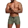 جيم ملابس الرجال القصيرة السراويل الصلبة ملونة في العضلات الجري تدريب السراويل القصيرة ضغط التمرين الرياضة