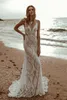 Abito da sposa a sirena in pizzo Boho Beach Spaghetti sottili cinghie Abiti da sposa lunghi Senza maniche Illusion Nude Fodera Backless Country Robe De Mariage 2023 Estate