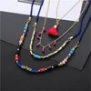 Collier ras du cou multicouche pour femmes, style bohème, pompon, coquillage, perles de rocaille, brin, perles courtes, croix en or, bijoux cadeau