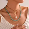 Collier ras du cou multicouche pour femmes, style bohème, pompon, coquillage, perles de rocaille, brin, perles courtes, croix en or, bijoux cadeau