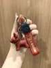 キーチェーンネットレッドスタンピングレザーロープ方法犬樹脂漫画キーブルファイトチャイカーバッグペンダント
