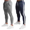 Pantaloni da uomo Pantaloni Fitness Nuovo tessuto elasticizzato sottile Design vuoto Palestra Sport Matita Pantaloni sportivi da esterno Pantaloni Rainbowtouches G220929