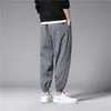 Pantaloni da uomo Pantaloni alla caviglia Harem scozzesi Abbigliamento da jogging Pantaloni Moda giapponese Pantaloni sportivi grigi M-3XL 2022 G220929