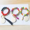 Gros bracelet en perles de silicone coréen velours pompon porte-clés options multicolores pour femmes