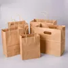 Enrolamento de presentes 50pcs/lote de sacos de plástico com alças Kraft Paper Bag Boutique Pacote para presentes Candy Candy Popcorn ZCZ013