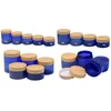 Verpackung: Leere Plastikflasche, klares und mattiertes blaues Glas, falsche Holz-Kunststoffabdeckung, nachfüllbar, kosmetischer tragbarer Verpackungsbehälter, 100 g, 120 g, 150 g, 200 g, 250 g