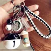 2022 Keychains Korean Creative Cute Cartoon Lovers Simulation 1 Gram Coffee Cup Star Dad Woven Rope Bell Key Chain Bag Pendant Harts Rubber Silicone