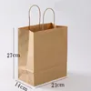 Enrolamento de presentes 50pcs/lote de sacos de plástico com alças Kraft Paper Bag Boutique Pacote para presentes Candy Candy Popcorn ZCZ013