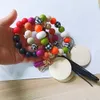 Gros bracelet en perles de silicone coréen velours pompon porte-clés options multicolores pour femmes
