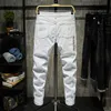 メンズジーンズファッショントレンディな刺繍レターメンカレッジボーイズスキニー滑走路ジッパーデニムパンツ破壊されたジーンズブラックホワイトジーンズ221008