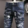 بنطلون جينز مطاطي بطبعة جرافيتي للرجال سروال كاوبوي جديد على الطراز الأوروبي والأمريكي