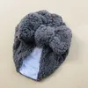 快適な温かい綿の幼児帽子ソリッドカラーボウノット新生児ビーニーキャップボウズヘッドウェアキッズヘアアクセサリー