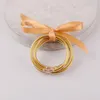 Bangle Fill Gold Powder Bowknot Friendship Glitter per bambini Braccialetto in gelatina di plastica in silicone per tutte le stagioni