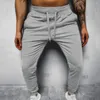Calça masculina cor de cor de tornozelo sólido Men com cintura elástica quentes bolsos de suporte de tamanho de tamanho de tamanho grande