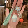 Porte-clés nouveau dessin animé créatif Yakult accessoires voiture porte-clés pendentif dégoulinant poupée en caoutchouc étudiant coréen PV cadeau