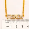 Collier design de luxe en acier inoxydable plaqué or 18 carats colliers tour de cou chaîne marque cristal lettre pendentif mode femmes bijoux de mariage accessoires MM2039