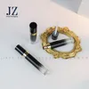 Brillant à lèvres Noir Faded Gold Garniture Luxueux Conteneur Paquet Vente En Vrac Personnalisé Logo Gratuit 5ml Tube Rond Vide Finition Brillante