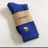 Chaussettes à serviettes pour hommes et femmes 2023 Fashion American Brand Carhart broderie de tube moyen marée inférieur de basket-ball de basket-ball