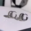 Nouveau charme mode 925 argent lettre géométrie célèbre femmes rondes en acier inoxydable boucles d'oreilles de mariage bijoux accessoires en gros ne se fanent jamais