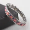 Länkarmband för kvinnor män par korsar silver blomma fjäril elastisk kraft rostfritt stål armband 2022 mode