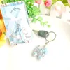 50pcs Baby menino chuveiro favorece Blue Baby Carriage Keychain Batening Baptismo Batismo Primeira Comunh￣o Partido Presente