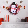 装飾的な花のクリスマスガーランドの壁の玄関の家の装飾のための飾り