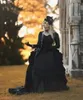 ヴィンテージ中世のビクトリア朝の黒いaラインウェディングドレスゴシックプリーツコルセットウェディングドレスと長袖ジャケットロイヤルブライダルドレス