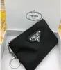 Luksusowy projektant kluczowy łańcuch nylonowa torebka płótno mężczyźni kobiety mini portfele breloki czarne zamykanie torebki kieszeni miłośnik breliza