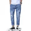 Jeans masculinos Alongamento masculino e fino calças de harém Blue azul claro Aumento casual rasgado