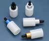 200pcs Spot Productos de alto grado Botella blanca vacía de 30 ml con cosméticos Cosméticos Embalaje de vidrio de viaje Bottalles SN450