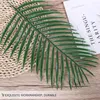 الزهور الزخرفية 20pcs ساغو الاصطناعية cycas LifeLike النباتات البلاستيكية النباتات الأخضر محاكاة أوراق أوراق الزخارف المنزلية