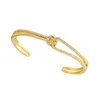 Bracelet large pour femmes manchette nouée en or accessoire de luxe de créateur bracelets durs cadeau de noël femme cuivre cadeaux de mariage élégants