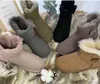 Designer bottes de neige chaud Mini U5854 femmes bottine classique hiver fourrure moelleux bottes en peau de mouton peau de vache en cuir véritable en peluche chaussons
