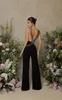 Sexig mantel Deep V Neck Black Jumpsuit Prom Dresses Backless Beadings Golvlängd Festklänning