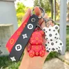 Porte-clés Violent ours clé silicone caoutchouc souple cartable poupée voiture pendentif petit filet rouge mignon