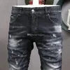 Nieuwe herenjeans Blue Bleach Jeans Tidy Biker Denim Jean Paint Spot Schade Slim Fit noodlijdende cowboypants man