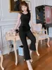 Pantaloni a due pezzi da donna Estate Elegante 2 pezzi Set Donna Nero Organza Patchwork Senza maniche Ruffles Top Fessura Perline Pantaloni svasati Ufficio