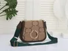 Classic one-shoulder crossbody bag round interlocking letter metal accessories leather piping canvas straps
