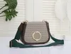 Classic one-shoulder crossbody bag round interlocking letter metal accessories leather piping canvas straps