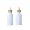 Groothandel Wit Porselein Essenti￫le oliedruppel Flessen Lege serumflessen 10-100 ml met Bamboo Cap