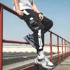 Pantalones para hombre 5XL monos de gran tamaño para hombre bolsillo de moda ropa de calle de 9 puntos pantalones casuales sueltos primavera otoño pantalones masculinos