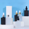 Flacon compte-gouttes en verre carré en gros 30 ml contenant d'huile essentielle givré noir clair avec bouchon noir argent doré