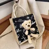 Bolsas de mochila bolsa de desenho animado bola de urso fofo saco de lona portátil compras portáteis estudantes de grande capacidade feminina eco-tote de viagem pano de ombro de viagem