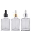 Flacon compte-gouttes en verre carré en gros 30 ml contenant d'huile essentielle givré noir clair avec bouchon noir argent doré