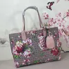 Blommig axel butik väska designer kvinnor handväskor lady tote väskor tvåsidig handväska gammal blomma duk äkta läder klassisk bokstäver kvalitet stor kapacitet 7 färger