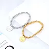 Strang Edelstahl elastisches Seil Perlenarmband für Frauen runder Charme Fantastisch