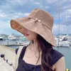 Cappelli a tesa larga Versione coreana del cappello da pescatore Big Edge Donna Primavera ed estate Fiori di pizzo perla dolce Protezione solare Secchio parasole