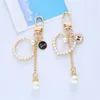 Keychains Lovely Peach Heart Pearl Keychain Charms Alloy Car Keyring AirPods Wireless Bluetooth Headset Accessories Women Bag Ornamente