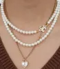 Collane con ciondolo Collana con medaglione di perle di conchiglia naturale Catena Figaro in acciaio inossidabile con bordo bianco Gioielli a forma di cuore con zirconi a forma di buco della serratura ERLI