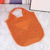 Tote Borsa di paglia intrecciata per le donne Viaggi Estate Borse da spiaggia Borsa Frizione INTRECCIATA RAFIA Temperamento gentile Ragazza Borsa Design vuoto Lettera Decorazione Bulk Commercio all'ingrosso